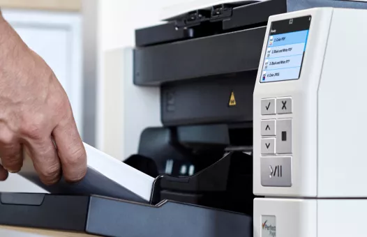 Paper being fed into a KODAK i4250 Scanner